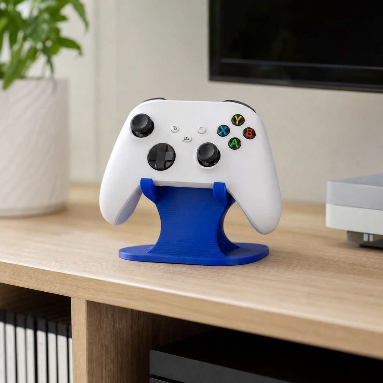 Blue 3D-printed display stand holding a game controller