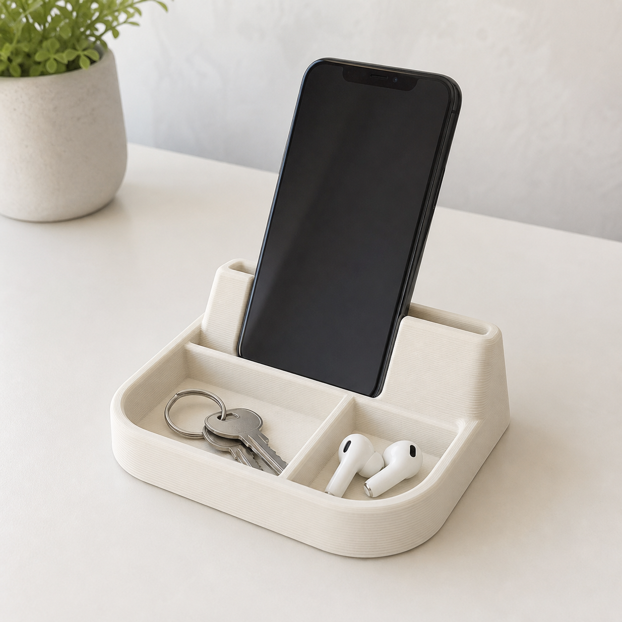 3D-printed phone stand with a tray for small everyday items